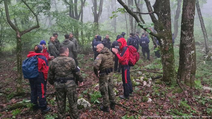 A mountain rescue team in the forest