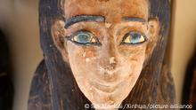 (220530) -- CAIRO, May 30, 2022 (Xinhua) -- Photo taken on May 30, 2022 shows the face of a colored coffin containing a mummy during an archaeological achievements exhibition at Saqqara necropolis, south of Cairo, Egypt. Egypt unveiled on Monday a major new archaeological find of 250 sealed coffins containing mummies, 150 bronze statues of ancient gods and goddesses, and other antiquities at the Saqqara necropolis, south of the capital Cairo. (Xinhua/Sui Xiankai)