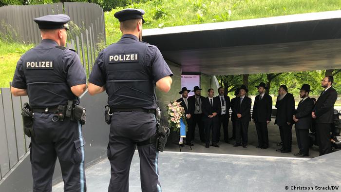 Rabbis guarded by police as they visit the site of the Munich attack in 1972