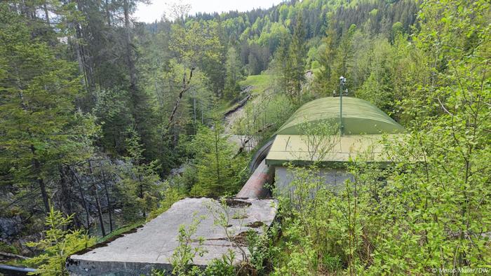 The top of the hydroelectric power plant surrounded by the forest.