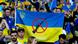 Ukraine fans hold up an anti-war banner. Ukraine fans hold up an anti-war banner.