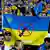 Ukraine fans hold up an anti-war banner.