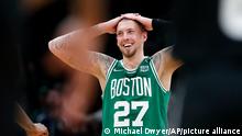 Boston Celtics' Daniel Theis reacts during the second half of Game 2 of an NBA basketball first-round Eastern Conference playoff series against the Brooklyn Nets, Wednesday, April 20, 2022, in Boston. (AP Photo/Michael Dwyer)
