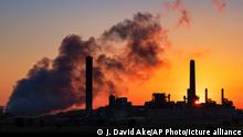 FILE - In this July 27, 2018, file photo, the Dave Johnson coal-fired power plant is silhouetted against the morning sun in Glenrock, Wyo. Jeremy Grantham, a British billionaire investor who's a major contributor to environmental causes, will fund carbon-capture research in Wyoming, the top U.S. coal-mining state. Wyoming's Republican governor, Mark Gordon, and the carbon-capture technology nonprofit Carbontech Labs announced Thursday, March 28, 2019, they're providing $1.25 million to help researchers find ways to turn greenhouse-gas emissions into valuable products. (AP Photo/J. David Ake, File)