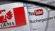 The websites of German performance rights organization GEMA and of video-sharing platform YouTube are shown behind a pair of glasses The websites of German performance rights organization GEMA and of video-sharing platform YouTube are shown behind a pair of glasses