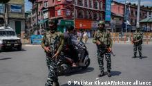 Indian paramilitary soldiers patrol in Srinagar, Indian controlled Kashmir, Thursday, June 2, 2022. Assailants fatally shot a Hindu bank manager in Indian-controlled Kashmir on Thursday, said police, who blamed militants fighting against Indian rule for the attack. (AP Photo/Mukhtar Khan)