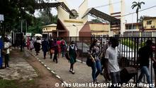 15.7.2021***A student carries luggage across the main gate as students leave as directed by authorities of the University of Lagos to halt the spread of Covid-19 on Campus in Yaba, Lagos, on July 15, 2021. - One of Nigeria's largest universities, the University of Lagos (UNILAG), on July 15, 2021, sent residential students home and said it would suspend physical attendance of lectures as fears grow over a new wave of coronavirus in Africa's most populous nation. (Photo by PIUS UTOMI EKPEI / AFP) (Photo by PIUS UTOMI EKPEI/AFP via Getty Images)