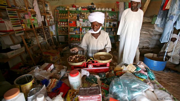 A trader weighs products inside a shop in N'djamena capital of Chad.