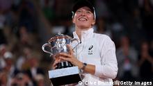 PARIS, FRANCE - JUNE 04: Iga Swiatek of Poland celebrates with the trophy after winning against Coco Gauff of The United States during the Women’s Singles final match on Day 14 of The 2022 French Open at Roland Garros on June 04, 2022 in Paris, France. (Photo by Clive Brunskill/Getty Images)