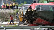 Police and workers are seen near an overturned railway carriage during salvage work at the site of a train derailment near Burgrain, north of Garmisch-Partenkirchen, southern Germany, on June 4, 2022, a day after the accident. - The death toll from the German train derailment near a Bavarian Alpine resort climbed to five on June 4 as a further body was recovered from the wreckage, police said. Investigators were combing the overturned carriages for victims and clues as to the cause of the accident on June 3 near Garmisch-Partenkirchen, a region gearing up to host the G7 summit in late June. (Photo by KERSTIN JOENSSON / AFP)