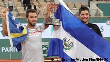  4th June 2022 Roland Garros, Paris, France: French Open Tennis tournament, mens doubles final Marcelo Arevalo ELS and Jean-Julien Rojer NED hold the winners trophy of the Men s Doubles after beating Ivan Dodig CROand Austin Krajicek USA PUBLICATIONxNOTxINxUK ActionPlus12397001 JonxBromley