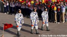 Chinese astronauts Chen Dong, Liu Yang and Cai Xuzhe attend a see-off ceremony before the launch of the Long March-2F carrier rocket, carrying the Shenzhou-14 spacecraft for a crewed mission to build China's space station, at Jiuquan Satellite Launch Center near Jiuquan, Gansu province, China June 5, 2022. China Daily via REUTERS ATTENTION EDITORS - THIS IMAGE WAS PROVIDED BY A THIRD PARTY. CHINA OUT.