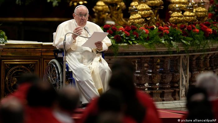 The pope in a wheelchair preaching in St. Peter's