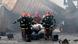 Firefighters carry the body of a victim from the site after a fire broke out at a container storage facility in Sitakunda, Bangladesh Firefighters carry the body of a victim from the site after a fire broke out at a container storage facility in Sitakunda, Bangladesh