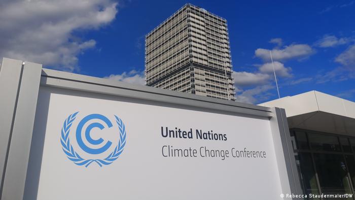 A sign for the United Nations Climate Change Conference is depicted in front of the UN's German headquarters in Bonn, Germany