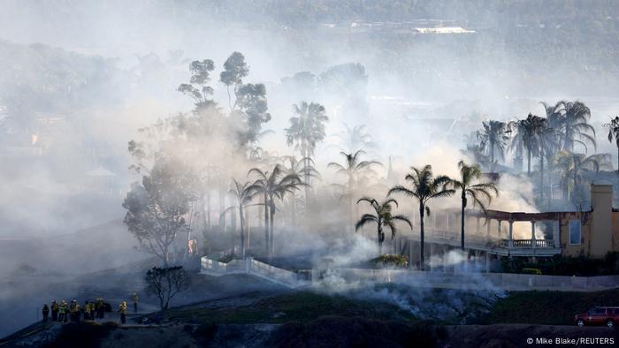 A wildfire in California reaches a residential area.