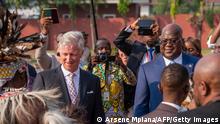 Belgium's King Philippe (C-L) and President of the Democratic Republic of the Congo Felix Tshisekedi (C-R) are seen upon his arrival at the N'djili International Airport in Kinshasa on June 7, 2022. - Belgium's King Philippe landed in the Democratic Republic of Congo on June 7, 2022 in a historic visit to the central African country his ancestor once ruled brutally as his personal fief. The monarch will undertake a six-day trip billed as a chance for reconciliation after atrocities committed under Belgian colonial rule. The visit comes two years after Philippe wrote to Congolese President Felix Tshisekedi to express his deepest regrets for the wounds of the past. (Photo by Arsene Mpiana / AFP) (Photo by ARSENE MPIANA/AFP via Getty Images)