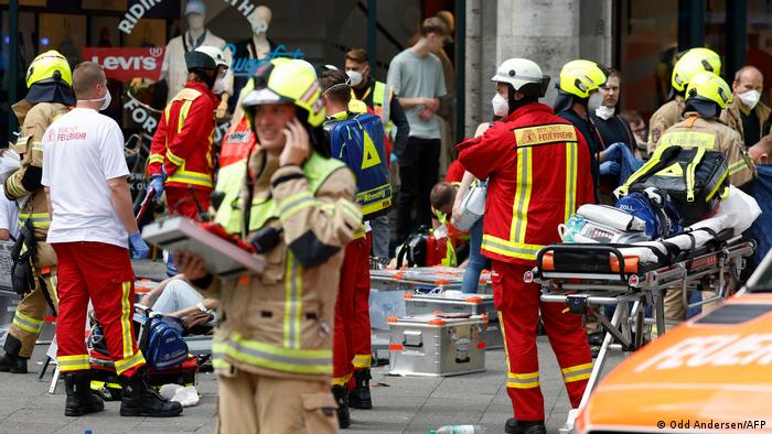 Rescue workers help injured people at the site where one person was killed several injured when a car drove into a group of people in central Berlin