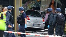 Police gather near the car that crashed into a group of people before hitting a storefront at Tauentzienstrasse in Berlin, Germany June 8, 2022. REUTERS/Fabrizio Bensch