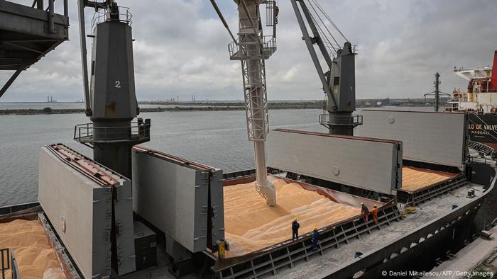 Workers assist the loading of corn on to a ship in the Black Sea port of Constanta, Romania, on May 3, 2022