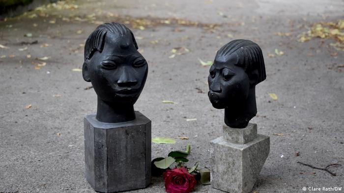 Two busts with a rose