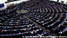 Members of the parliament vote on plans to reduce carbon emissions, at the European Parliament, Wednesday, June 8, 2022 in Strasbourg, eastern France. The future of car transport in Europe may become clearer — and cleaner —on Wednesday when the European Parliament decides whether to ban vehicles with a combustion engine starting in the middle of the next decade. (AP Photo/Jean-Francois Badias)