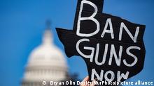 A person holds a sign at a Students Demand Action rally near the U.S. Capitol on June 6, 2022, calling for Congressional action on gun safety in the wake of the Buffalo and Uvalde shootings. (Photo by Bryan Olin Dozier/NurPhoto)