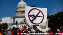 A person holds a sign at a Students Demand Action rally near the U.S. Capitol on June 6, 2022, calling for Congressional action on gun safety in the wake of the Buffalo and Uvalde shootings. (Photo by Bryan Olin Dozier/NurPhoto)