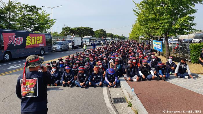Members of the Cargo Truckers Solidarity union attend a protest in front of Hyundai Motor's factory in Ulsan, South Korea.
