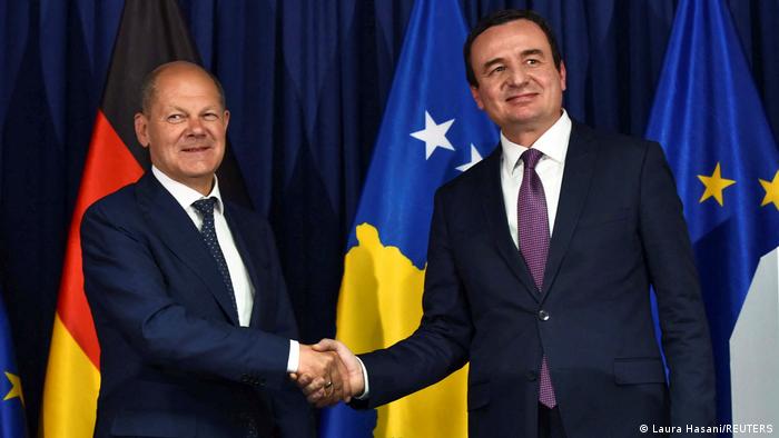 Germany's Chancellor Olaf Scholz and Kosovo’s Prime Minister Albin Kurti shake hands after a news conference in Pristina's Chancellor Olaf Scholz and Kosovo’s Prime Minister Albin Kurti shake hands after a news conference in Pristina