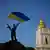 view of Kyiv church, silhouette of fighter with gun and Ukrainian flag