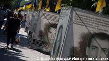 10.06.2022 *** Many photos of the inhabitants who died dur to Russia's invasion and the Ukrainian flags are exhibited at a main street in Khmelnytskyi, western Ukraine, on June 10, 2022. Russia's military invasion has continued in Ukraine.( The Yomiuri Shimbun via AP Images )