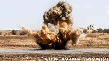 A landmine is remotely detonated in a field at a pistachio orchard in the village of Maan, north of Hama in west-central Syria on June 24, 2020. - Pistachio farmers in central Syria are hoping that reduced violence will help revive cultivation of what was once one of the country's top exports. Maan, famed for its pistachio production, was controlled for years by jihadists and their rebel allies but it fell to the government at the start of the year following a months-long offensive. And as violence subsided, many formerly displaced farmers have returned, hoping this season will mark the revival of what was once a leading industry. (Photo by LOUAI BESHARA / AFP) (Photo by LOUAI BESHARA/AFP via Getty Images)