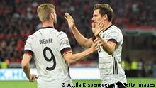 Germany's midfielder Jonas Hofmann (R) celebrates scoring the 1-1 goal with his teammate Germany's forward Timo Werner during the UEFA Nations League football match Hungary v Germany at the Puskas Arena in Budapest on June 11, 2022. (Photo by Attila KISBENEDEK / AFP) (Photo by ATTILA KISBENEDEK/AFP via Getty Images)