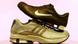 An Adidas shoe beneath a Nike shoe An Adidas shoe beneath a Nike shoe