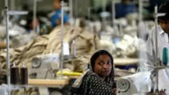 A Bangladeshi woman works in a textile factory on the outskirts of Dhaka, Bangladesh, Wednesday, Feb. 2, 2005. The European Union has decided to give Bangladesh zero tariff entry into its $ 70 billion clothing market from July this year, a move that may boost the country's export to the EU, according to media reports. Bangladesh, a nation of 140 million people, earns three-fourths of its foreign exchange from textile exports. The industry directly employs 1.8 million people and indirectly provides work for about 5 million. (AP Photo/Manish Swarup)