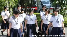 High school students wearing summer uniforms due to a seasonal change of clothing go to school in Abeno Ward, Osaka on May 8, 2017. ( The Yomiuri Shimbun via AP Images )