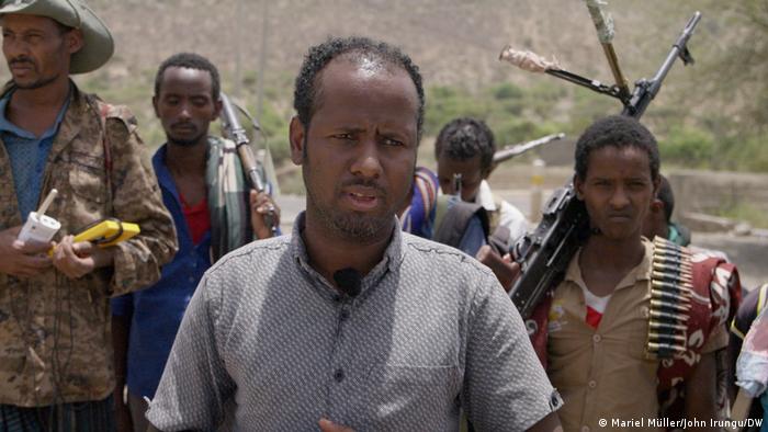 Mayor of Abala, Tahir Hassen with armed bodyguards.