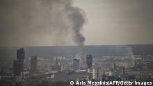 TOPSHOT - Smoke rises from the city of Severodonetsk in the eastern Ukrainian region of Donbas on June 13, 2022, amid Russian invasion of Ukraine. - The cities of Severodonetsk and Lysychansk, which are separated by a river, have been targeted for weeks as the last areas still under Ukrainian control in the eastern Lugansk region. (Photo by ARIS MESSINIS / AFP) (Photo by ARIS MESSINIS/AFP via Getty Images)