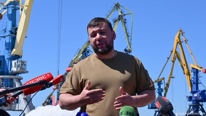 Denis Pushilin speaks to journalists in Mariupol on June 12