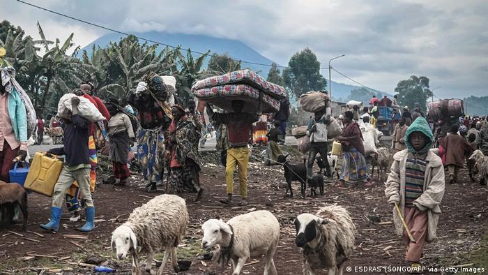  Residents leave the Kibati and Kibumba villages with their belongings in Goma