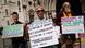 Demonstrators hold placards as they protest against Britain's Rwanda asylum plan outside the High Court in London on June 13, 2022. Demonstrators hold placards as they protest against Britain's Rwanda asylum plan outside the High Court in London on June 13, 2022.