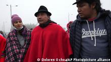 Indigenous Leader Leonidas Iza,center, talks with protesters at a blockade point during a national protest against the government of Guillermo Lasso called mainly by indigenous organizations in Cotopaxi, Ecuador, Monday, June 13, 2022. (AP Photo/Dolores Ochoa)