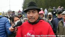 The president of the Confederation of Indigenous Nationalities in Ecuador (Conaie), Leonidas Iza, speaks to members of the media in a road blocked by indigenous people and farmers in San Juan de Pastocalle, Cotopaxi province, Ecuador, on June 13, 2022. - Ecuador's main indigenous movement began a cycle of protests against the government of conservative President Guillermo Lasso on Monday, blocking roads in several provinces to demand lower fuel prices, local authorities said. (Photo by Cristina Vega RHOR / AFP) (Photo by CRISTINA VEGA RHOR/AFP via Getty Images)