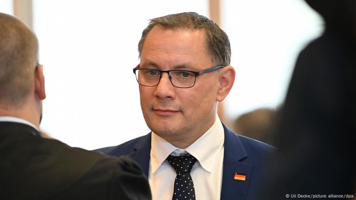 AfD co-chair Tino Chrupalla wears a German-flag lapel pin AfD co-chair Tino Chrupalla wears a German-flag lapel pin