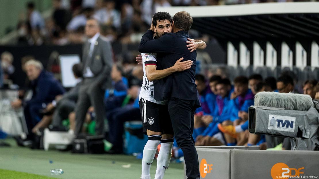 Ilkay Gündogan hugs Hansi Flick