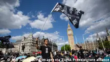 June 12, 2022, London, United Kingdom: Pro-democracy demonstrator waves flag during a rally at Parliament square in London to mark the third anniversary of the start of massive pro-democracy protests which roiled Hong Kong in 2019 Organisers claimed about four thousands attended the rally. (Credit Image: © May James/SOPA Images via ZUMA Press Wire