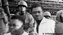 A picture taken in December 1960, shows soldiers guarding Patrice Lumumba (R), Prime Minister of then Congo-Kinshasa, and Joseph Okito (L), vice-president of the Senate, upon their arrest in Leopoldville (now Kinshasa). Belgian justice has been declared competent on December 12, 2012 to investigate on the responsibility of a dozen of Belgians allegedley involved in the assassination of the former Congolese prime minister. Lumumba was the first democratically elected prime minister of Congo after it gained independence from Belgium on June 30, 1960. He was murdered by Katanga officials on January 17, 1961 after Joseph-Desire Mobutu took power in a coup. The country, now known as the Democratic Republic of Congo, was renamed Zaire by Mobutu. A Belgian parliamentary inquiry concluded in 2001 that Belgium had a moral responsibility in Lumumba's assassination and the government apologised to its former colony, but no legal action was taken afterwards. AFP PHOTO / STRINGER (Photo by STRINGER / AFP) (Photo by STRINGER/AFP via Getty Images)