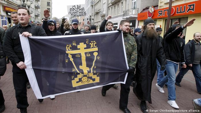 Russian neo-Nazis carry flags and give Nazi salutes in downtown Moscow during a sanctioned 2008 protest