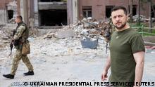 Ukraine's President Volodymyr Zelenskiy walks on a street during a visit to the southern city of Mykolaiv, as Russia's attack on Ukraine continues, Ukraine June 18, 2022. Ukrainian Presidential Press Service/Handout via REUTERS ATTENTION EDITORS - THIS IMAGE HAS BEEN SUPPLIED BY A THIRD PARTY.